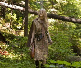 Girl in forest wearing retro clothes Stock Photo