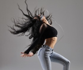 Girl with headphones dancing Street dance Stock Photo