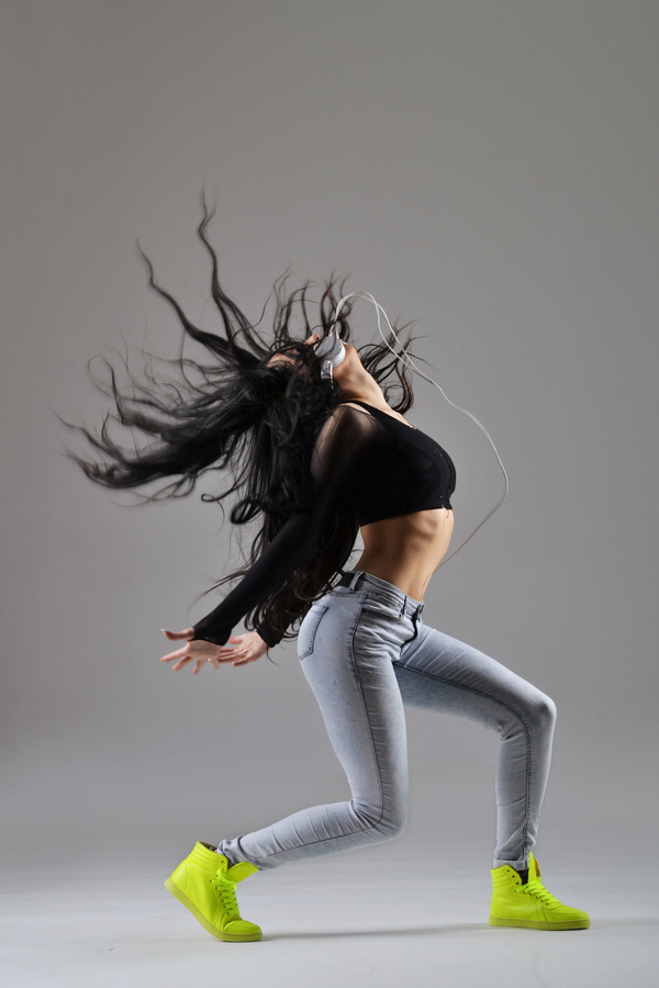 Girl with headphones dancing Street dance Stock Photo