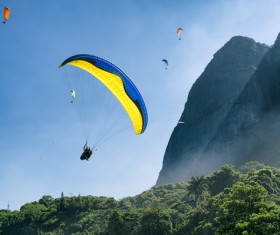 Gliding umbrella in the sky Stock Photo 01