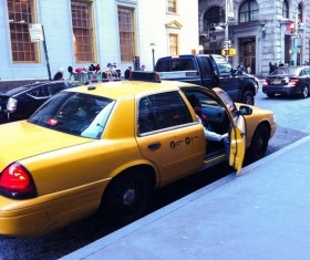 Guests coming down from the taxi Stock Photo