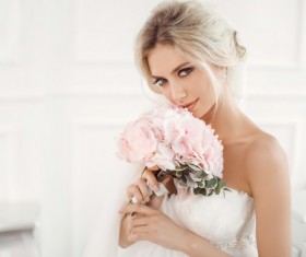 Hand holding bouquet of beautiful bride Stock Photo