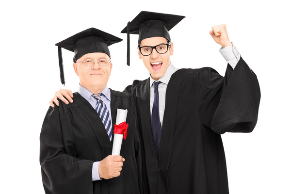 Happy graduated boys and professors photo Stock Photo