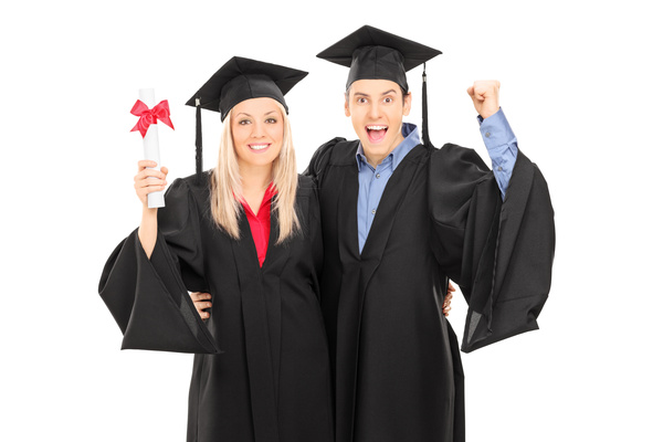 Happy male and female graduates posing Stock Photo