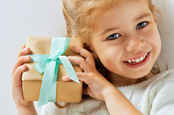Holding a gift box happy little girl Stock Photo 01