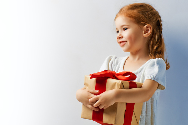Holding a gift box happy little girl Stock Photo 02
