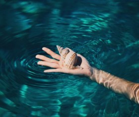 Holding the hand of the conch Stock Photo