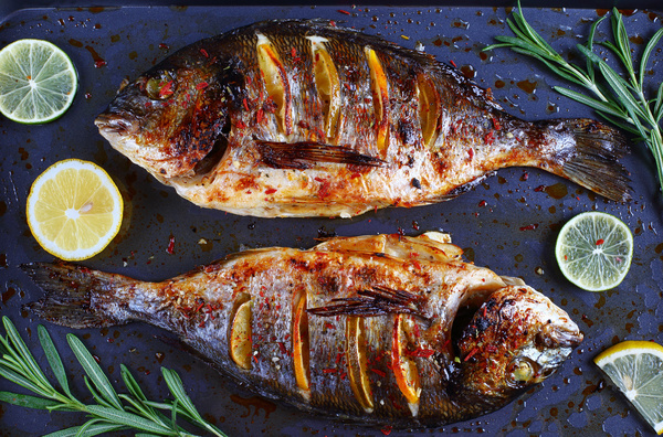 Lemon roasted fish Stock Photo