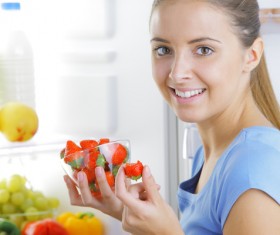 Little girl eating strawberry Stock Photo