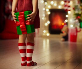 Little girl holding gift box on Christmas night Stock Photo