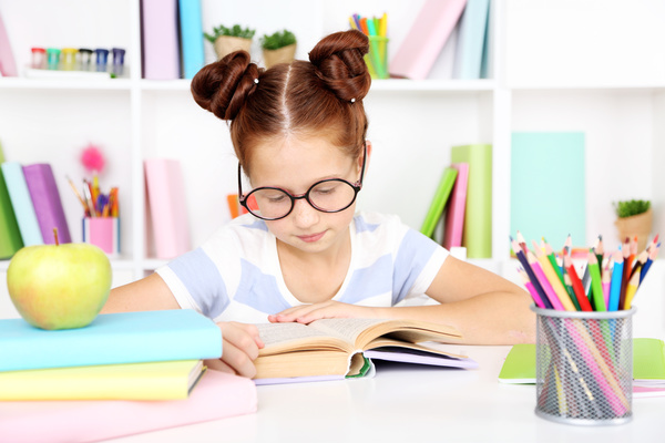 Little girl reading seriously Stock Photo