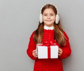 Little girl receiving gifts on Christmas Day Stock Photo 02