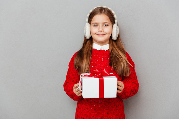 Little girl receiving gifts on Christmas Day Stock Photo 02