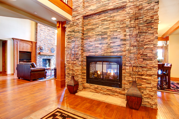 Living room with stone fireplace Stock Photo