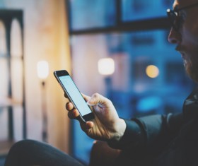 Man looking at smartphone Stock Photo