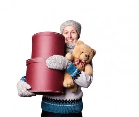 Middle aged woman holding teddy bear and gift box Stock Photo