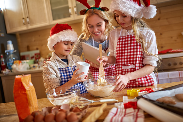 Mother and child make Christmas food together Stock Photo