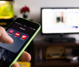 On-demand with iPhone smartphone Stock Photo