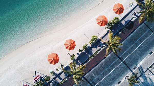 Overhead umbrellas on the beach Stock Photo