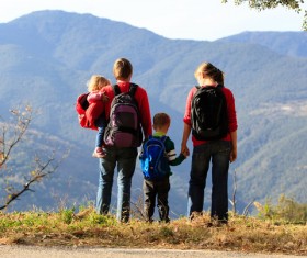 Parents who climb mountains with their children Stock Photo