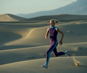 Running woman in the desert Stock Photo 01