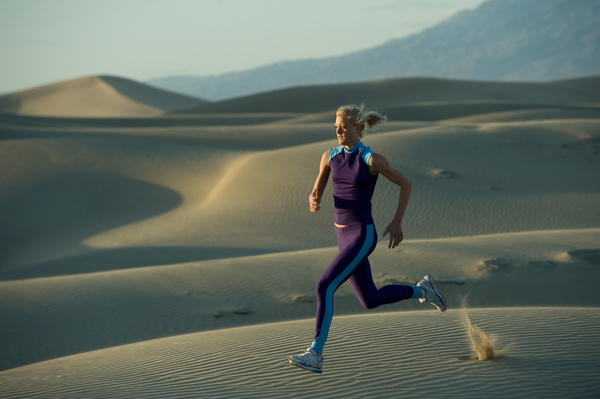 Running woman in the desert Stock Photo 01