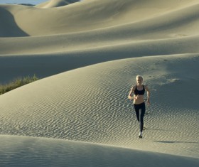 Running woman in the desert Stock Photo 02