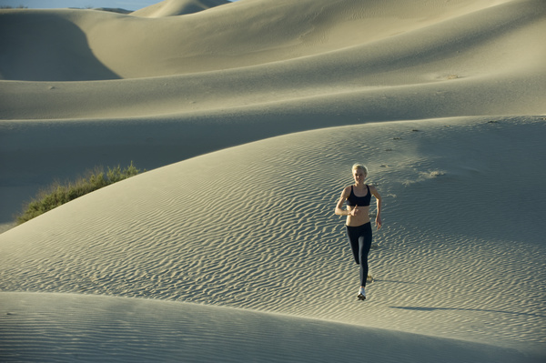 Running woman in the desert Stock Photo 02