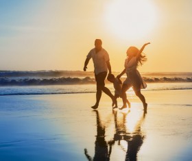 Seaside walking family Stock Photo