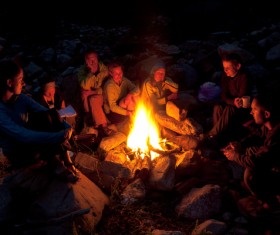 Sitting around the campfire Stock Photo