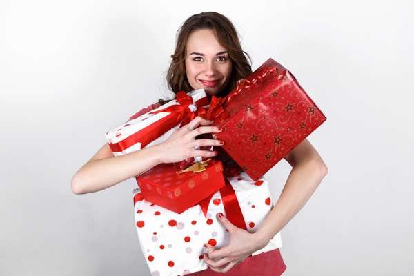 Smiling woman holding gift box Stock Photo 01