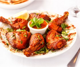 Spicy chicken legs with ketchup Stock Photo