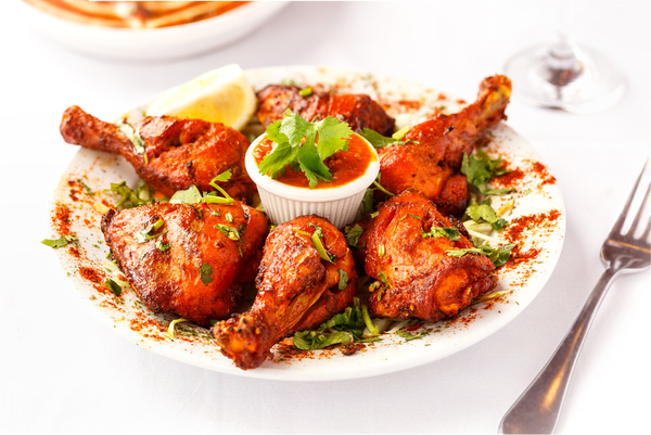 Spicy chicken legs with ketchup Stock Photo
