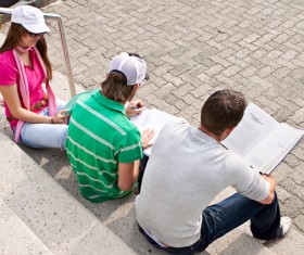 Students sitting on the steps Stock Photo