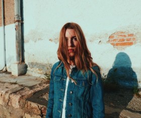 Stylish young woman posing outdoor with casual clothes Stock Photo