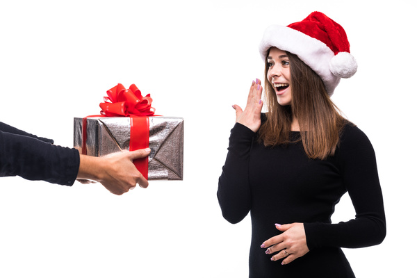 Surprise girl received Christmas gift Stock Photo