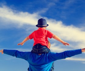 The child sitting on the fathers shoulder Stock Photo 02