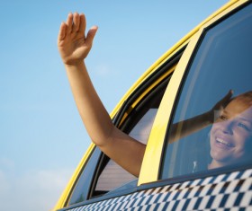 The girl who looks at the sun in Taxi Stock Photo 01