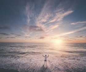 The man standing in the waves Stock Photo