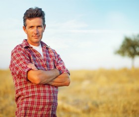 The man standing in the wheat field Stock Photo