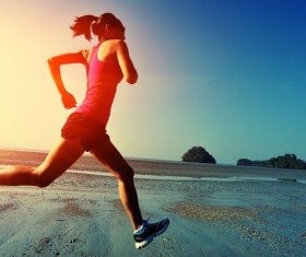 The woman running on the beach Stock Photo 01