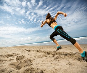 The woman running on the beach Stock Photo 02