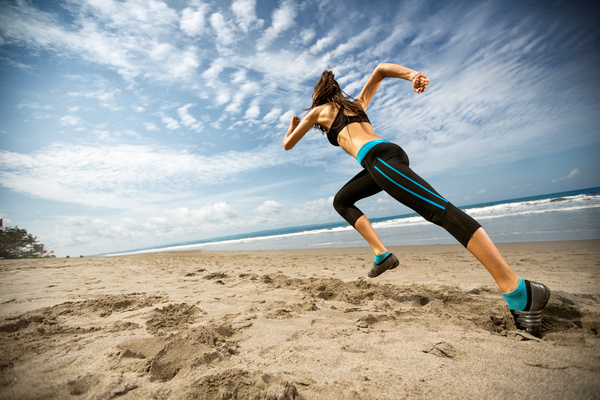 The woman running on the beach Stock Photo 02