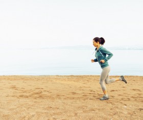 The woman running on the beach Stock Photo 03