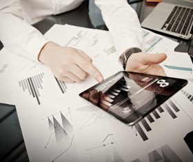 Use tablet to do business data analysis Stock Photo 01