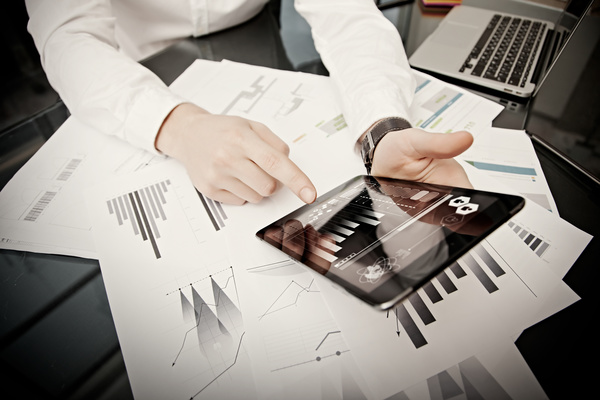 Use tablet to do business data analysis Stock Photo 01