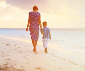 Walking on the beach mother and child Stock Photo
