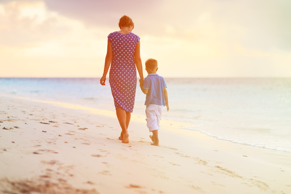 Walking on the beach mother and child Stock Photo