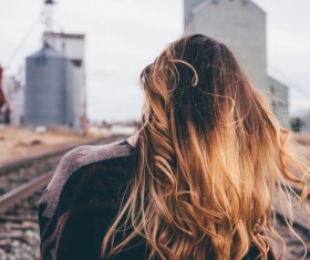 Walking on the railway girl back view Stock Photo