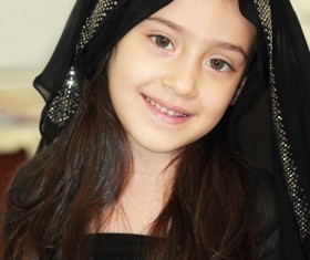 Wearing black veil beautiful little girl Stock Photo